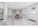 Formal dining room features neutral walls, natural light, and wood-look floors at 812 60Th S St, Gulfport, FL 33707