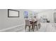 Dining room features neutral walls, natural light, wood-look floors, and seating for six at 812 60Th S St, Gulfport, FL 33707