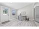 Bright home office has natural light, neutral paint, and wood-look flooring at 812 60Th S St, Gulfport, FL 33707