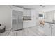 Spacious kitchen features stainless refrigerator and ample storage in white cabinets at 812 60Th S St, Gulfport, FL 33707
