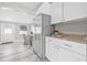 Modern kitchen featuring stainless steel appliances, granite countertops, and a dining area at 812 60Th S St, Gulfport, FL 33707