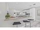 Modern kitchen featuring granite countertops, stainless steel appliances, breakfast bar, and open floor plan at 812 60Th S St, Gulfport, FL 33707