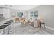 Bright and airy living room featuring a modern open concept, neutral colors, and luxury vinyl plank flooring at 812 60Th S St, Gulfport, FL 33707