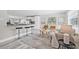 Bright and airy living room featuring a modern open concept and luxury vinyl plank flooring at 812 60Th S St, Gulfport, FL 33707
