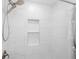 Elegant shower with stylish tile work and a built-in niche for toiletries at 812 60Th S St, Gulfport, FL 33707