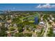 Aerial view of property and neighborhood with golf course, bay, and city skyline views in the distance at 852 Cordova Ne Blvd, St Petersburg, FL 33704