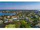 Panoramic aerial view showcases the property's location on a golf course with serene water views at 852 Cordova Ne Blvd, St Petersburg, FL 33704