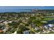 Aerial view of property near the bay, city skyline, mature trees and upscale neighborhood on a clear sunny day at 852 Cordova Ne Blvd, St Petersburg, FL 33704