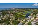 Aerial view highlights the property's proximity to a golf course, lake and the city skyline at 852 Cordova Ne Blvd, St Petersburg, FL 33704