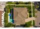 Aerial view of a stunning property with a private pool, lush landscaping, and a well-maintained roof at 852 Cordova Ne Blvd, St Petersburg, FL 33704