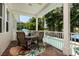 Cozy back patio with comfortable seating, perfect for outdoor dining and enjoying the tranquil pool view at 852 Cordova Ne Blvd, St Petersburg, FL 33704