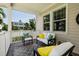 Welcoming back porch with comfortable seating, offering a relaxing spot to enjoy the views and fresh air at 852 Cordova Ne Blvd, St Petersburg, FL 33704