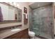 Modern bathroom featuring a glass-enclosed shower, stylish vanity, and neutral color palette at 852 Cordova Ne Blvd, St Petersburg, FL 33704