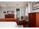 Bedroom with wood floors and view into the ensuite bathroom at 852 Cordova Ne Blvd, St Petersburg, FL 33704
