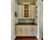 Charming butler's pantry with glass-front cabinets, ample countertop space, and stylish backsplash at 852 Cordova Ne Blvd, St Petersburg, FL 33704