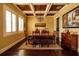 Formal dining room boasting hardwood floors, coffered ceilings, and a stylish chandelier at 852 Cordova Ne Blvd, St Petersburg, FL 33704