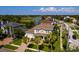 Desirable location with lush landscaping, palm trees, and views of the golf course and lake at 852 Cordova Ne Blvd, St Petersburg, FL 33704