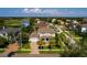 The exterior of this charming home includes an attached two-car garage, lush landscaping, and a brick driveway at 852 Cordova Ne Blvd, St Petersburg, FL 33704