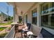 Charming front porch featuring rocking chairs and stone pillar accents at 852 Cordova Ne Blvd, St Petersburg, FL 33704