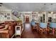 Open-concept living space with a kitchen island, leather sofa, staircase, and hardwood floors at 852 Cordova Ne Blvd, St Petersburg, FL 33704