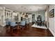 Bright and airy kitchen with a large island, stainless steel appliances, and adjacent dining area with a decorative rug at 852 Cordova Ne Blvd, St Petersburg, FL 33704