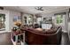 Cozy living room with a leather sofa, comfortable seating, and a large television for entertainment at 852 Cordova Ne Blvd, St Petersburg, FL 33704