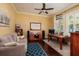 Cozy home office with couch, desk, and plenty of natural light at 852 Cordova Ne Blvd, St Petersburg, FL 33704