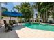 Beautiful backyard pool area with spa, shaded seating, and lounge chairs for the ultimate relaxation and enjoyment at 852 Cordova Ne Blvd, St Petersburg, FL 33704