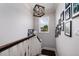 Elegant staircase features dark wood steps, white risers, and a modern light fixture at 852 Cordova Ne Blvd, St Petersburg, FL 33704