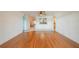 Open living room with hardwood floors offering seamless transitions to the other living spaces at 913 El Rancho Dr, Sun City Center, FL 33573