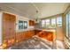 Sunroom features a bar area with a chandelier and tiled flooring at 913 El Rancho Dr, Sun City Center, FL 33573