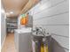 Practical laundry room with washer, dryer, water heater, and storage at 918 E 24Th Ave, Tampa, FL 33605