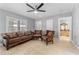 Inviting living room features neutral walls, tile flooring, ceiling fan and traditional-style furniture at 918 E 24Th Ave, Tampa, FL 33605