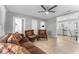 Inviting living room features neutral walls, tile flooring, ceiling fan and traditional-style furniture at 918 E 24Th Ave, Tampa, FL 33605
