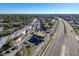 Aerial view of condo complex near a highway, showcasing the surrounding area and accessibility at 9201 Tudor Dr # C212, Tampa, FL 33615
