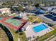 Aerial view showcasing the community pool and tennis court at 9201 Tudor Dr # C212, Tampa, FL 33615