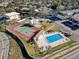 Aerial view showcasing the community pool and tennis court at 9201 Tudor Dr # C212, Tampa, FL 33615