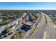 Aerial view of condo complex near a highway, showcasing the surrounding area and accessibility at 9201 Tudor Dr # C212, Tampa, FL 33615