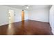 Large bedroom featuring hardwood floors, a ceiling fan, and large windows at 9201 Tudor Dr # C212, Tampa, FL 33615