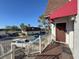 The front entryway features a red awning, a brown door, and a view of the parking area at 9201 Tudor Dr # C212, Tampa, FL 33615