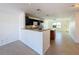 Bright kitchen features granite counters, black cabinets, and modern appliances at 9201 Tudor Dr # C212, Tampa, FL 33615