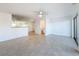 Spacious living room features a ceiling fan and tile flooring at 9201 Tudor Dr # C212, Tampa, FL 33615