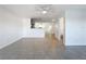 Spacious living room features a ceiling fan and tile flooring at 9201 Tudor Dr # C212, Tampa, FL 33615