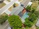 An aerial view of a well-maintained home with a large screened in pool at 9241 Cochise Ln, Port Richey, FL 34668