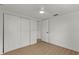 Bedroom features wood floors, closet and a door to the hallway at 9241 Cochise Ln, Port Richey, FL 34668