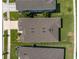 Birds-eye view of roof with skylights and landscaped grounds, showcasing the property's layout at 9271 Rally Spring Loop, Wesley Chapel, FL 33545