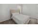 Bedroom featuring a bed with headboard and carpeted floors at 9271 Rally Spring Loop, Wesley Chapel, FL 33545