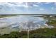 Scenic aerial view of a large lake, highlighting the property's waterfront access at 9271 Rally Spring Loop, Wesley Chapel, FL 33545