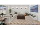 Living room with comfortable sectional sofa, contemporary accents, and sliding glass doors to the back patio at 9271 Rally Spring Loop, Wesley Chapel, FL 33545
