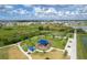 Aerial shot of the neighborhood playground including walking path, playground and shaded seating areas at 9271 Rally Spring Loop, Wesley Chapel, FL 33545